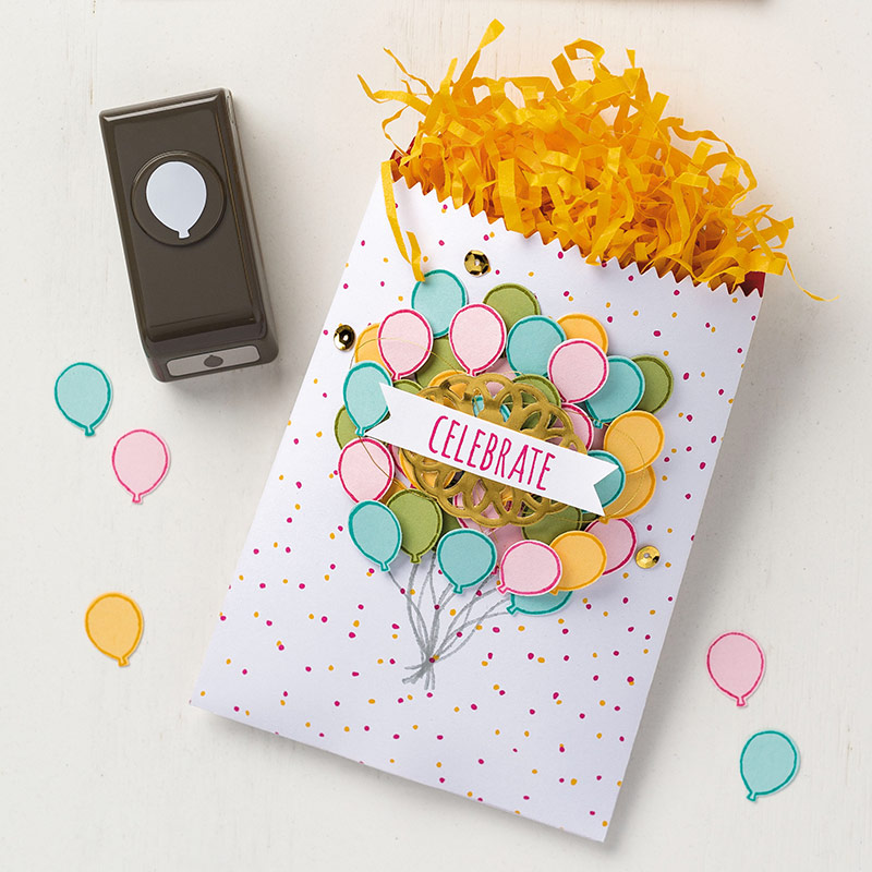 Treat bag decorated with balloons punched by the Party Punch Pack