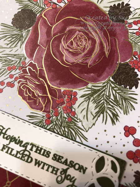 Close up of the Christmastime Is Here Specialty Designer Series Paper showing the gold embossing